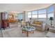 Spacious living area showcasing water views and elegant furniture at 988 Blvd Of The Arts # 1512, Sarasota, FL 34236