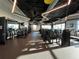 Well-equipped gym with modern exercise machines, mirrors, and natural light at 10109 Milky Way Cir, Sarasota, FL 34241