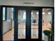 Entrance to the gymnasium at 'The Hub' with glass doors and 'Gymnasium' sign above at 10109 Milky Way Cir, Sarasota, FL 34241