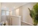 Upstairs hallway featuring neutral paint, carpet flooring, and attractive decor at 10109 Milky Way Cir, Sarasota, FL 34241