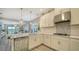 Bright and airy kitchen featuring stainless steel appliances and tile backsplash at 10109 Milky Way Cir, Sarasota, FL 34241