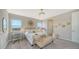 Cozy main bedroom with natural light, desk area, and adjoining bath at 10109 Milky Way Cir, Sarasota, FL 34241