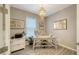 Bright home office features wood-look tile flooring and a decorative chandelier at 10109 Milky Way Cir, Sarasota, FL 34241