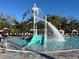 Gathering-friendly pool area with a splash pad, slide, and various seating options at 10109 Milky Way Cir, Sarasota, FL 34241