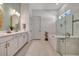 Modern bathroom with soaking tub and walk in shower at 10201 Beach Dune Dr, Englewood, FL 34223