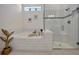 Bright bathroom with walk-in shower and built in seat at 10201 Beach Dune Dr, Englewood, FL 34223