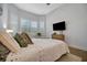 Spacious bedroom with wood floors and window seating at 10201 Beach Dune Dr, Englewood, FL 34223