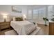 Spacious bedroom with wood floors and window seating at 10201 Beach Dune Dr, Englewood, FL 34223