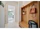 Bright entryway with built-in bench and storage at 10201 Beach Dune Dr, Englewood, FL 34223