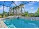 Relax in this lovely screened pool and spa at 10201 Beach Dune Dr, Englewood, FL 34223