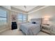 Comfortable bedroom with water views and nightstands at 10510 Boardwalk Loop # 404, Lakewood Ranch, FL 34202