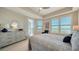 Bright bedroom with water views and a comfortable bed at 10510 Boardwalk Loop # 404, Bradenton, FL 34202