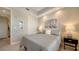 Cozy bedroom with a queen-size bed and adjacent bath at 10510 Boardwalk Loop # 404, Bradenton, FL 34202