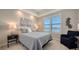 Guest bedroom with water views and comfortable bed at 10510 Boardwalk Loop # 404, Bradenton, FL 34202