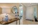 Elegant entryway with console table and a view of the bedroom at 10510 Boardwalk Loop # 404, Bradenton, FL 34202