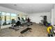 Fitness center with modern equipment and lake views at 10510 Boardwalk Loop # 404, Lakewood Ranch, FL 34202