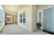 Bright hallway with light walls and a modern door at 10510 Boardwalk Loop # 404, Bradenton, FL 34202