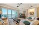 Bright living room with water views, comfy seating, and a coffee table at 10510 Boardwalk Loop # 404, Bradenton, FL 34202