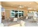 Relaxing patio area with tables and chairs at 10510 Boardwalk Loop # 404, Lakewood Ranch, FL 34202