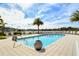 Inviting swimming pool with patio chairs and lake views at 10510 Boardwalk Loop # 404, Bradenton, FL 34202