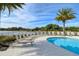 Enjoy this pool area with plenty of lounge chairs at 10510 Boardwalk Loop # 404, Lakewood Ranch, FL 34202