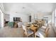 Bright dining area with light wood floors and seating for eight at 11124 Sanctuary Dr, Bradenton, FL 34209