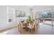 Bright dining room with light wood table and chairs, access to back patio at 11124 Sanctuary Dr, Bradenton, FL 34209