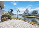 Large brick patio overlooking tranquil canal views at 11124 Sanctuary Dr, Bradenton, FL 34209