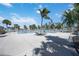 Community pool with lounge chairs under shade umbrellas at 11124 Sanctuary Dr, Bradenton, FL 34209