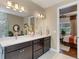 Elegant bathroom with double vanity and view of bedroom at 12366 Marsh Pointe Rd, Sarasota, FL 34238