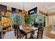 Farmhouse-style dining room with sliding glass doors to the pool area at 12366 Marsh Pointe Rd, Sarasota, FL 34238