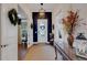 Bright and spacious foyer with a dark blue accent wall at 12366 Marsh Pointe Rd, Sarasota, FL 34238