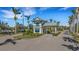 Gated community entrance with palm trees and a guardhouse at 12366 Marsh Pointe Rd, Sarasota, FL 34238