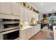 Spacious kitchen with stainless steel appliances and white cabinets at 12366 Marsh Pointe Rd, Sarasota, FL 34238