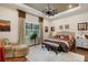 Relaxing main bedroom with a king-size bed and wood flooring at 12366 Marsh Pointe Rd, Sarasota, FL 34238