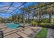 Resort-style pool, spa, and putting green with screened enclosure at 12366 Marsh Pointe Rd, Sarasota, FL 34238