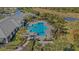 Aerial view of community pool with surrounding lounge chairs at 12366 Marsh Pointe Rd, Sarasota, FL 34238