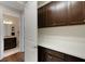 Storage or pantry room with white countertop and dark cabinets at 12366 Marsh Pointe Rd, Sarasota, FL 34238