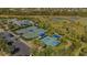 Two tennis courts and two pickleball courts with shade at 12366 Marsh Pointe Rd, Sarasota, FL 34238