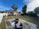 Backyard with fire pit, patio furniture and a large patio at 1308 W Cypress St, Tampa, FL 33606