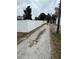 Gravel driveway and fenced backyard at 1308 W Cypress St, Tampa, FL 33606