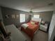 Bright bedroom with orange bedding and white nightstand at 1308 W Cypress St, Tampa, FL 33606