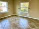 Bedroom with tile floors and large windows at 1414 6Th W St, Palmetto, FL 34221