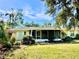 Back exterior view with screened porch and yard at 1414 6Th W St, Palmetto, FL 34221