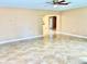 Bright living room with tile floors and a view into the kitchen at 1414 6Th W St, Palmetto, FL 34221