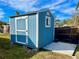 Blue storage shed in the backyard at 1414 6Th W St, Palmetto, FL 34221