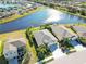 Aerial view of a house near a lake with lush landscaping at 14822 Trinity Fall Way, Bradenton, FL 34212