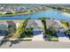 Aerial view of a waterfront house with surrounding homes at 14822 Trinity Fall Way, Bradenton, FL 34212