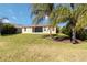 House with screened lanai and grassy backyard at 14822 Trinity Fall Way, Bradenton, FL 34212