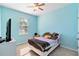 Light blue bedroom with a double bed and TV at 14822 Trinity Fall Way, Bradenton, FL 34212